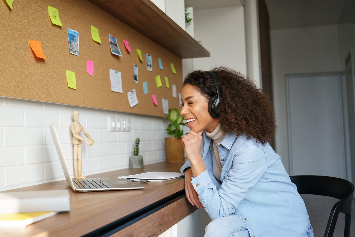 Young Woman Working Indoors with Laptop