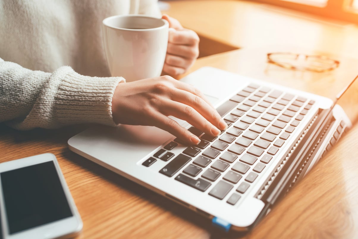 Woman Working in Home on Her Laptop Computer.